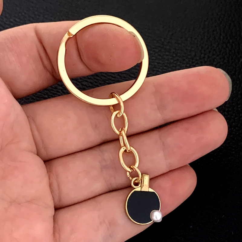 Black Red sports table tennis  - Table Tennis Keychain recension och pris